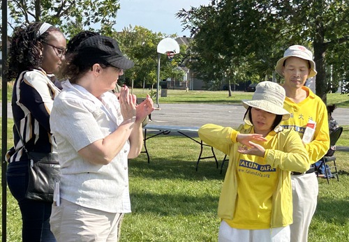 Catherine Allison (second from left) said she felt peaceful after doing the Falun Dafa exercises.