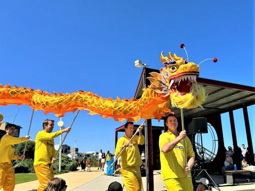 Practitioners perform a dragon dance.