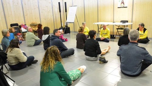 Expo visitors wait to learn the meditation exercise on March 10.