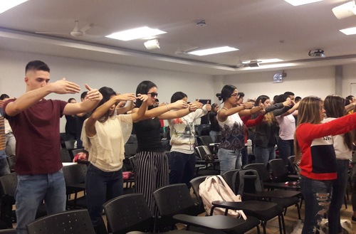 Students learn to do the second Falun Dafa exercise.