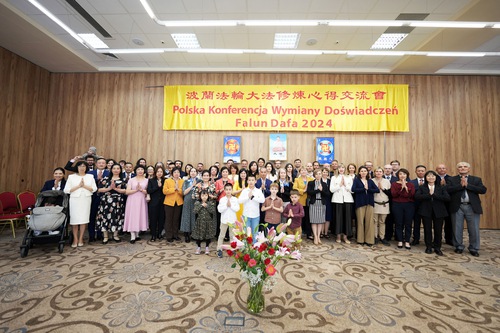 Practitioners in Poland celebrate World Falun Dafa Day in Warsaw on May 11.