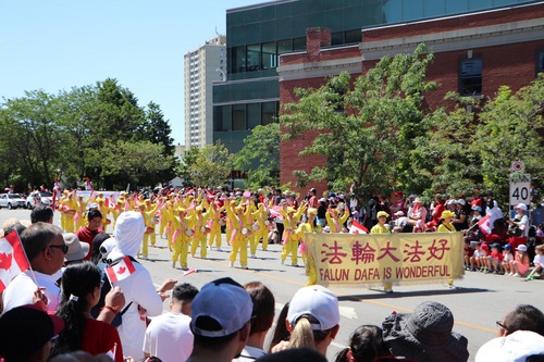 The Tian Guo Marching Band, exercise team, and waist drummers in the Mississauga Canada Day Parade on July 1