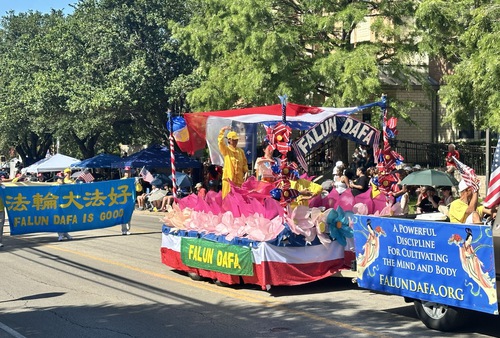 The Falun Dafa procession passes the University of Texas at Arlington.
