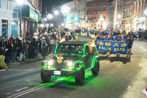 Falun Dafa practitioners participate in the Tree Lighting Parade & Ceremony in Middletown on November 29.