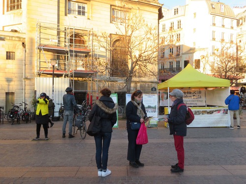 Falun Dafa practitioners demonstrate the exercises and tell people about the persecution during an event in Châtelet on November 29.