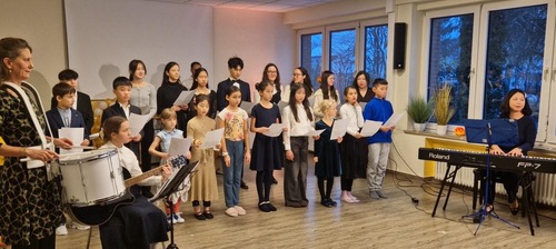 Children demonstrated the exercises and sang in a chorus during the recital.