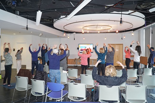 Participants learn the second Falun Dafa exercise.