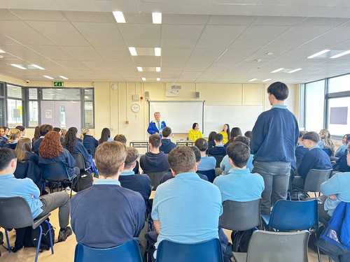 A student asks questions during the Q&A session.