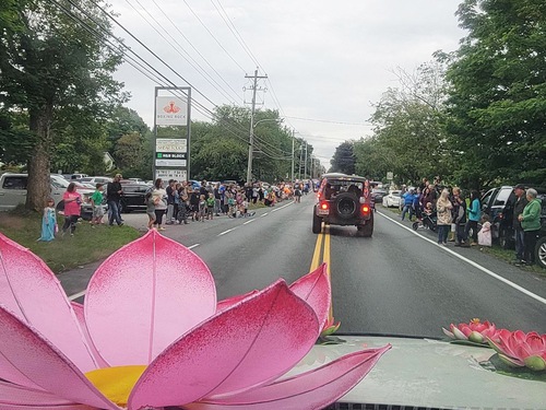 Practitioners participate in a parade in Clare, Nova Scotia, on August 15, 2024