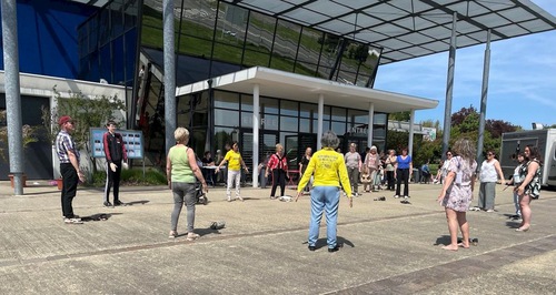 Visitors learn Falun Gong on the square outside the Health and Organic Lifestyle Expo in Saint-Brevin-les-Pins.