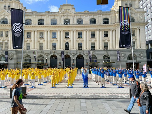 Practitioners do the Falun Dafa exercises during the Falun Dafa Day celebration on May 10.